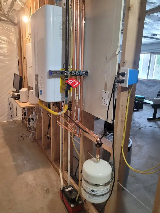 Licensed plumber repairing a kitchen sink in Round Lake
